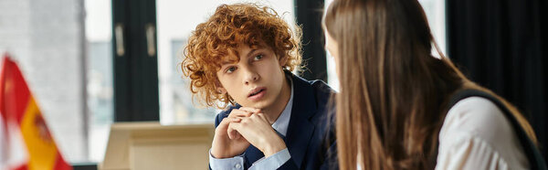 Two teenagers participate in a UN Model simulation.