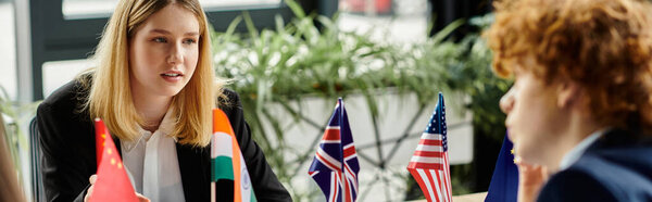 Teenagers participate in a Model United Nations conference, engaging in lively discussion.