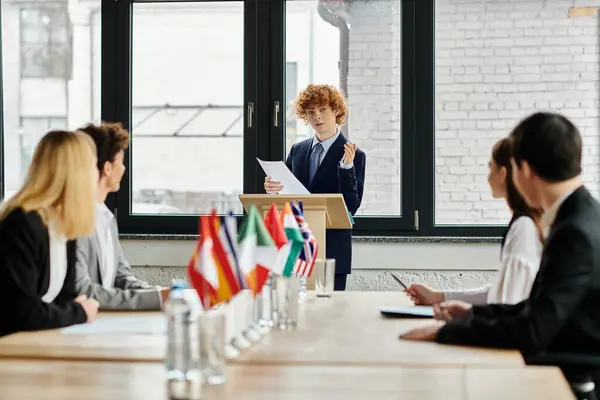 stock image Teenagers participate in a UN Model conference, engaging in diplomatic discussions.