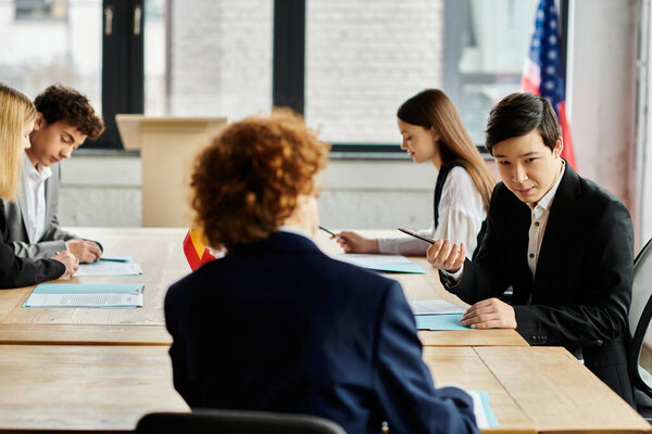 Teenagers participate in a Model UN conference, engaging in diplomatic debate and role-playing.