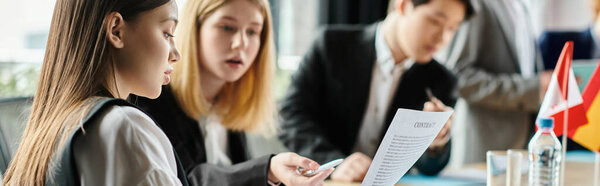 Teens join Model UN, debate global issues.