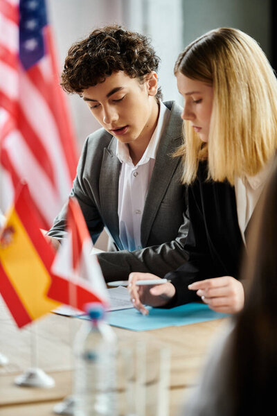 Two teenagers participate in a UN Model conference, focusing on international affairs.