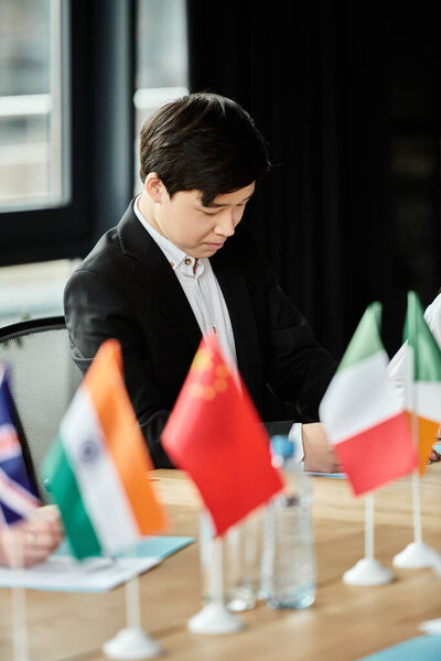 A teenage delegate focuses intently during a Model United Nations conference.