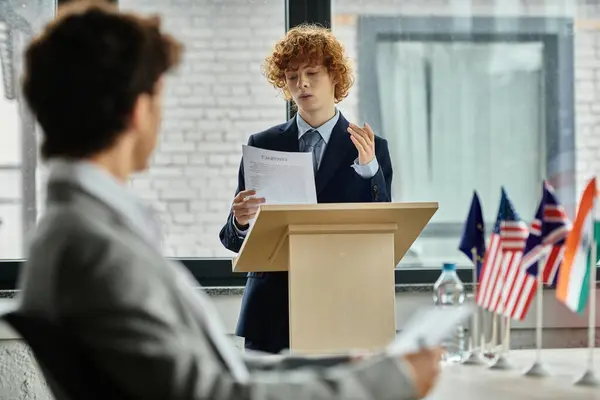 stock image Teenage boy gives a speech at a UN Model conference.