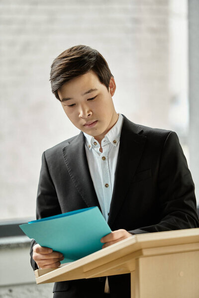 A young delegate prepares to deliver a speech at a UN Model conference.