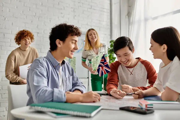 Stock image Four teenagers participate in a UN Model simulation, engaging in a discussion about global issues.