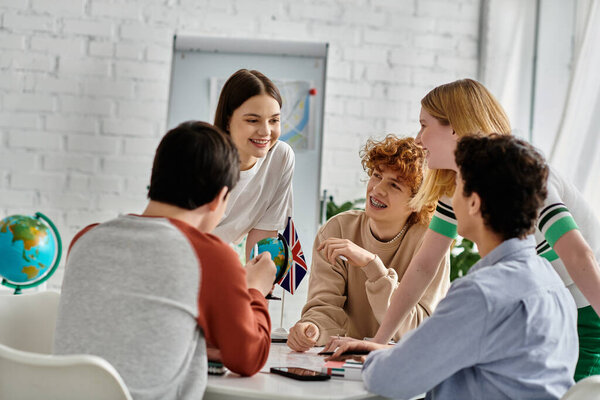 Teenagers gather around a table, engaged in a lively discussion during a UN Model conference.