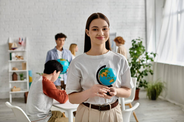 A teenager holds a globe during a UN Model session.
