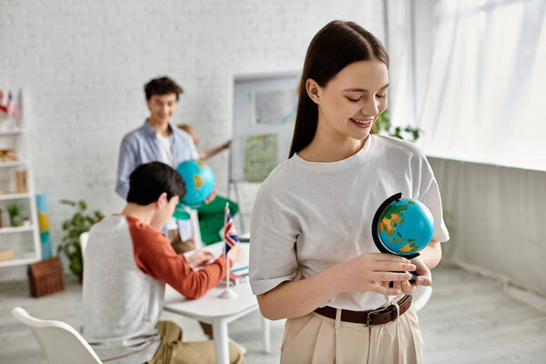 A teenager holds a globe during a UN model simulation.