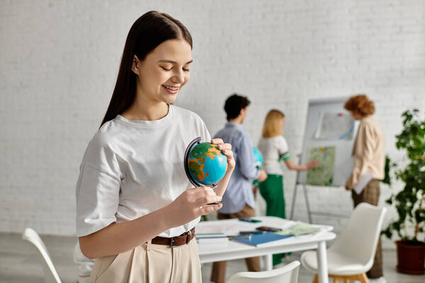Teenage girl holds a globe during a UN Model conference.