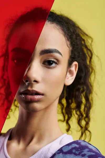 stock image A young woman poses with a red neon glass in a studio setting.