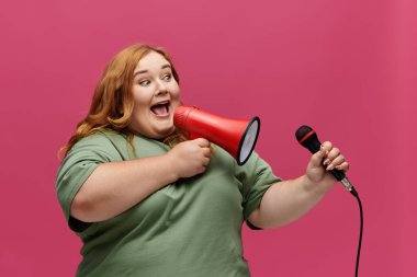 A woman in a green shirt speaks through a megaphone and holds a microphone. clipart