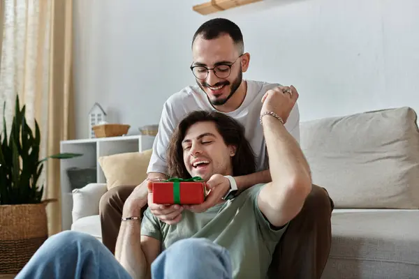 stock image A gay couple shares a special moment together, filled with joy and affection.