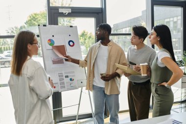 A diverse startup team presents data and ideas around a whiteboard, strategizing for growth. clipart