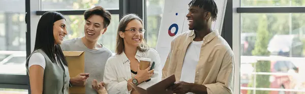 stock image A group of young professionals are working on their startup in a bright and modern office space.