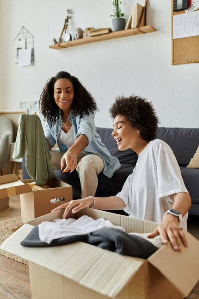 An LGBT couple joyfully transforms old clothes into new styles.