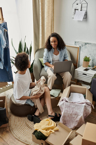 Couple joyfully transforms old clothes into new creations while brainstorming ideas.