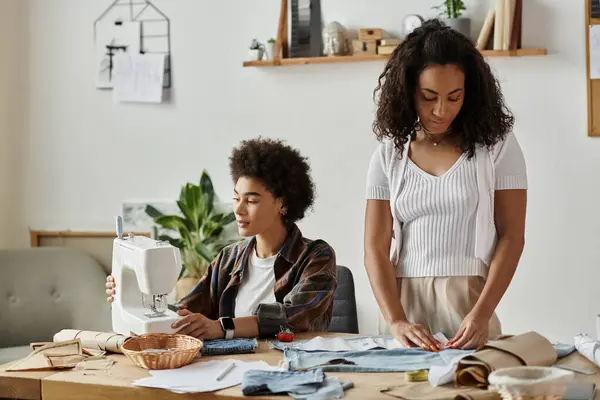 stock image A couple joyfully transforms old clothes into new fashion statements.