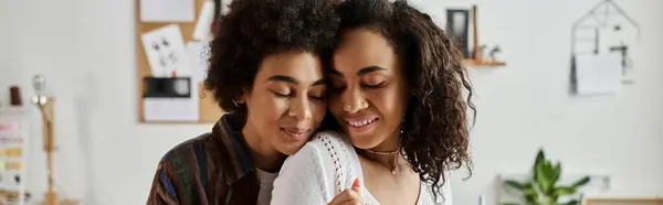 stock image Couple joyfully hugging at home while upcycling clothes.