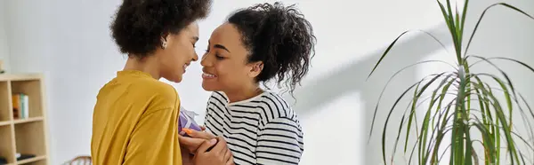 stock image A couple shares a loving moment while enjoying each others company indoors.