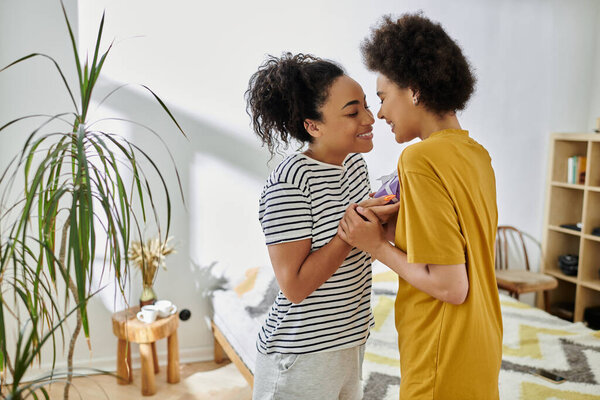 A loving couple shares a tender moment in their stylish home.