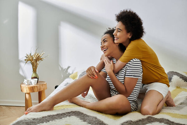 A loving couple enjoys each other's presence in a warm, inviting space.