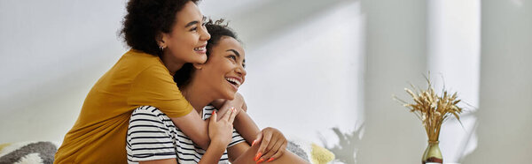 Two loving partners share laughter and warmth in their cozy home.