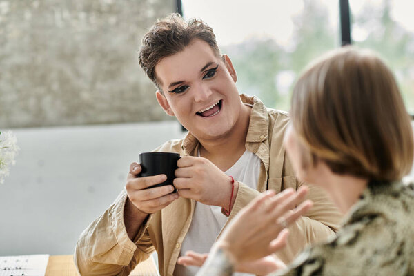 A joyful moment shared over coffee between two friends at home.