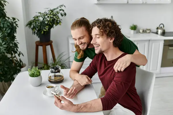 stock image A loving couple shares laughter over coffee while enjoying their morning.