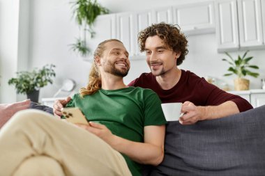 A loving couple shares a cozy moment while relaxing together at home. clipart