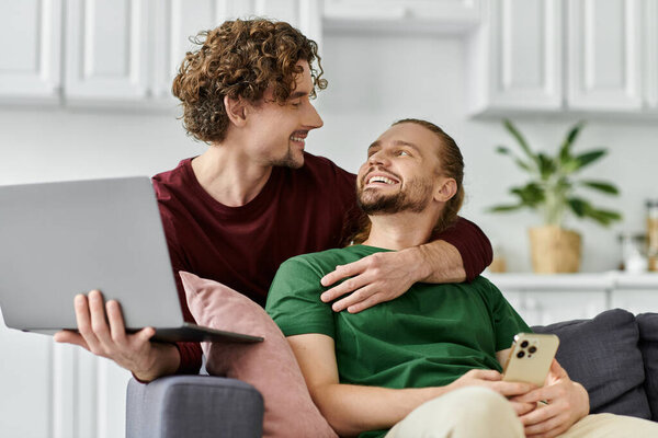 A loving couple enjoys quality time, laughing and connecting in their cozy home.