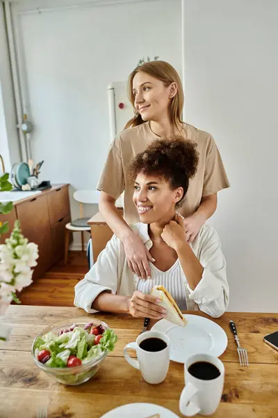 stock image Two partners share a delightful meal filled with joy and affection.