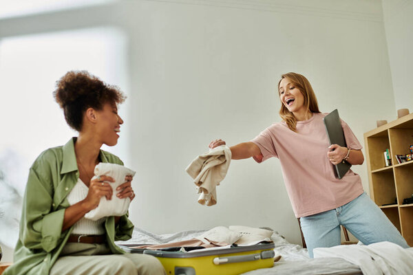 Loving partners packing belongings with laughter in their warm, inviting sanctuary.