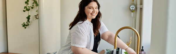 A cheerful woman is smiling while preparing food at her kitchen counter.