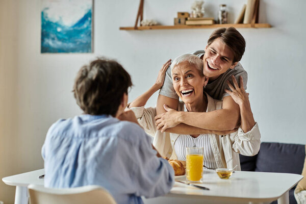 A warm breakfast filled with laughter as a lesbian couple enjoys a meal with their adult son.