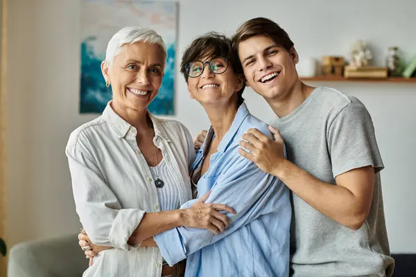 stock image A joyful LGBTQ family shares laughter and love in their inviting living room on a sunny afternoon.