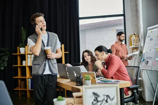 Stock image Team members discuss plans while in office.