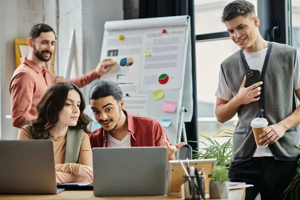 stock image Professionals in casual attire collaborate during a challenging office moment.