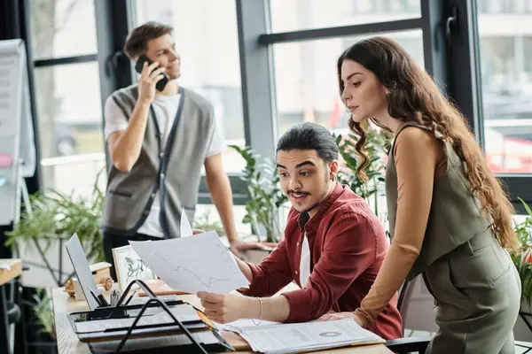 stock image Team members engage in crucial discussions in office.