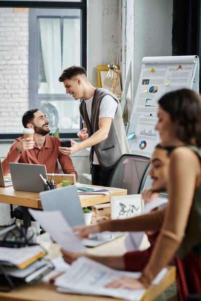 Colleagues interact casually while in office.