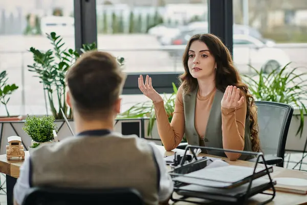 stock image Colleagues converse thoughtfully amidst the uncertainty of layoffs.