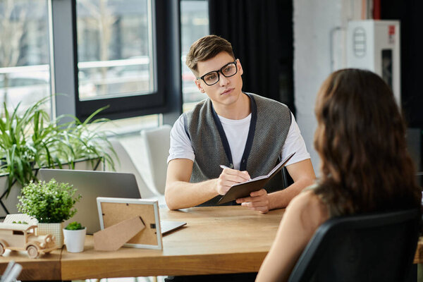 Colleagues discussing layoff details in a stylish and modern workspace.