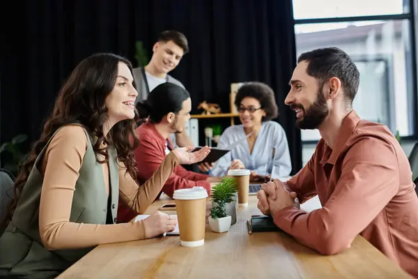 Stock image Colleagues converse with empathy while navigating challenging time.