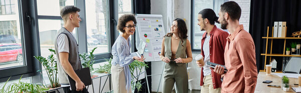 Team members interact thoughtfully amidst organizational changes.