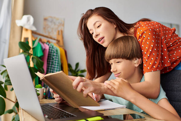 A loving mother shares a joyful learning moment with her son.