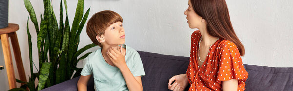 A mother and her son engage in a tender conversation together.