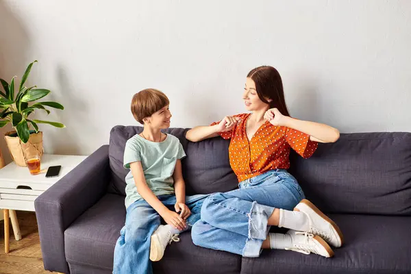 Stock image A mother and her little son enjoy a heartfelt conversation together.