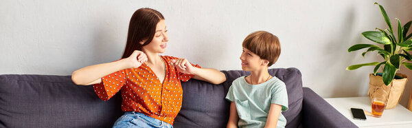 A mother and her hearing impaired son share a playful moment together.