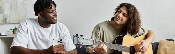 A couple shares laughter and music in their warm home environment while connecting deeply.