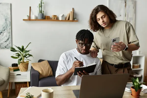 stock image A couple enjoys their time together as they work on projects and share ideas at home.